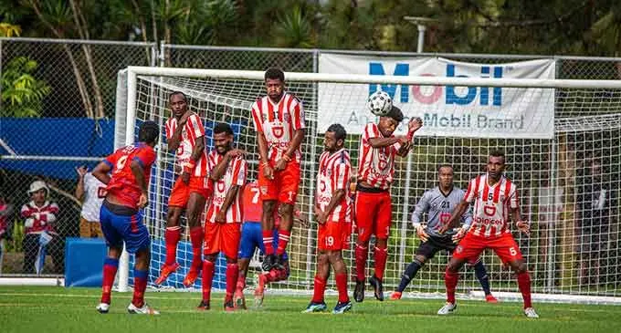 Navua striker Melvin Mani (back to camera) kicks a freekick as the Labasa players defended anxiously at the Uprising Sports Centre in Pacific Harbour, Deuba, on July 17, 2022. Photo: Leon Lord