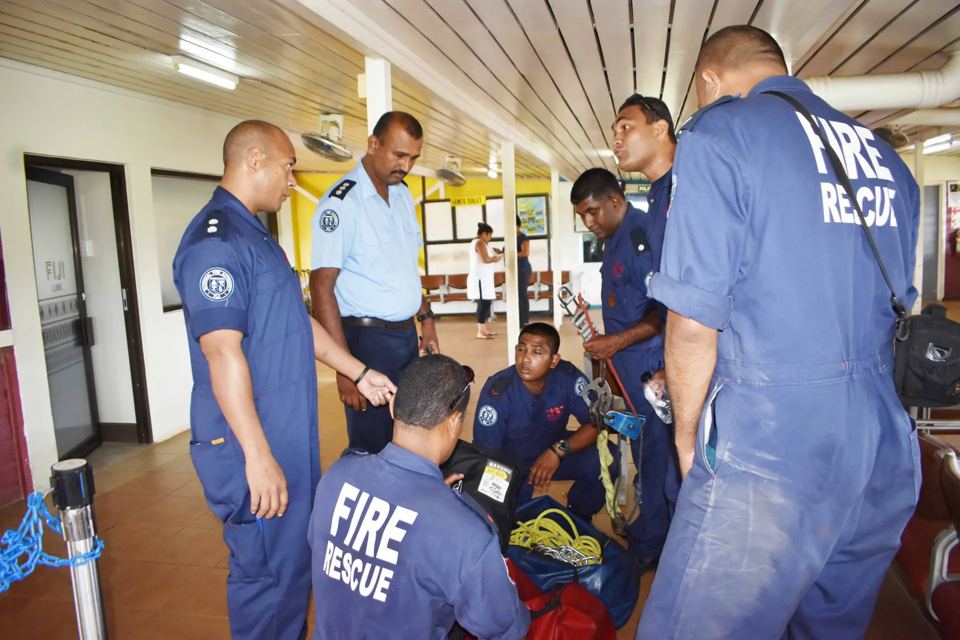 Divisional Fire Officer Vinesh Kumar (light blue shirt) with fire officers at the Waiqele Airport on March 1, 2018 before moving to the crash site. Photo: WATI TALEBULA