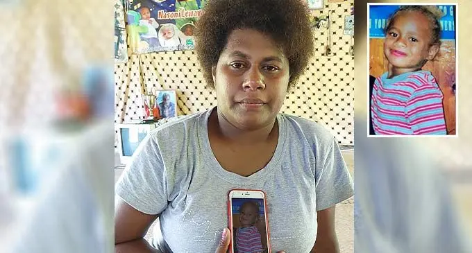Mereani Lotovavula holds a photo of her late daughter, Mere Ilisoni Laulau inside her home at Waicoba Village in Sigatoka on November 22, 2022. Insert Photo: The late, Mere Ilisoni Laulau. Photo: Nicolette Chambers
