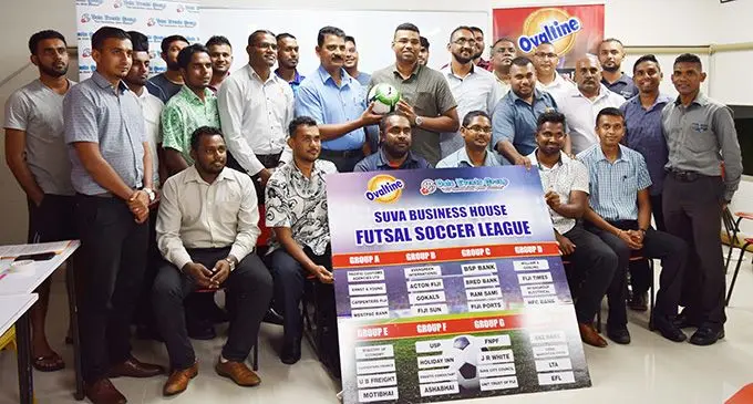 Team managers with organisers and sponsors during the Ovaltine Suva Business-house Futsal pool draws.