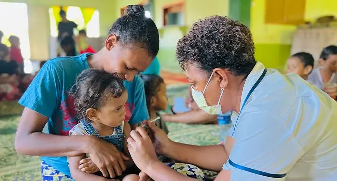 Unaisi Mara with her daughter Laisa Helen, 2, receiving her measles vaccine by nurse Asenaca Lautiki at Navavatu Methodist Church in Delaitokatoka, Valelevu on July 12, 2022. Photo: Nolishma Narayan