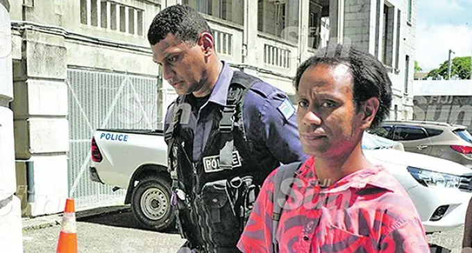 Simione Tugi. escorted to court.