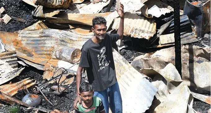 Kapil Prakash with son Akash Prakash after their 4 bedroom house was destroyed in a fire at Lakeba Street, in Samabula, on November 4, 2021. Photo: Ronald Kumar