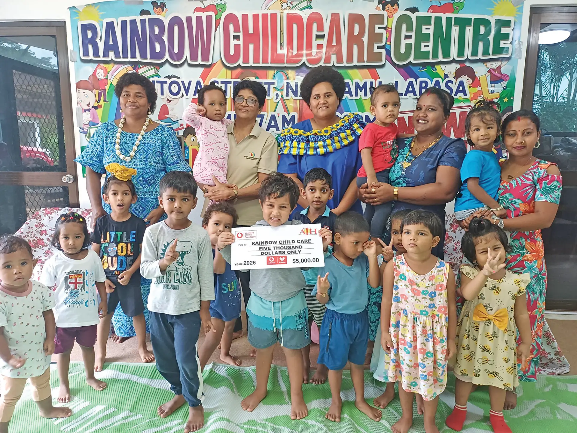 Vodafone ATH Fiji Foundation director and trustee Manarusa Vanabale (in garland), with Rainbow Child Day Care Centre founder Sheela Krishna, staff and children on May 25, 2026.