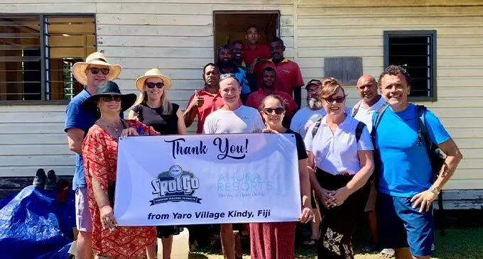 From right: Ahura Resorts owners Tony and Brigid Whitton with his staff , SpotGo representatives and members of the Yaro community.