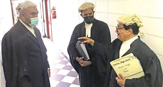 Director of Public Prosecutions lawyers Semi Babitu, Taitusi Tuenuku with defence lawyer Iqbal Khan (right) outside the Lautoka High Court on December 14, 2021.   Photo: Waisea Nasokia