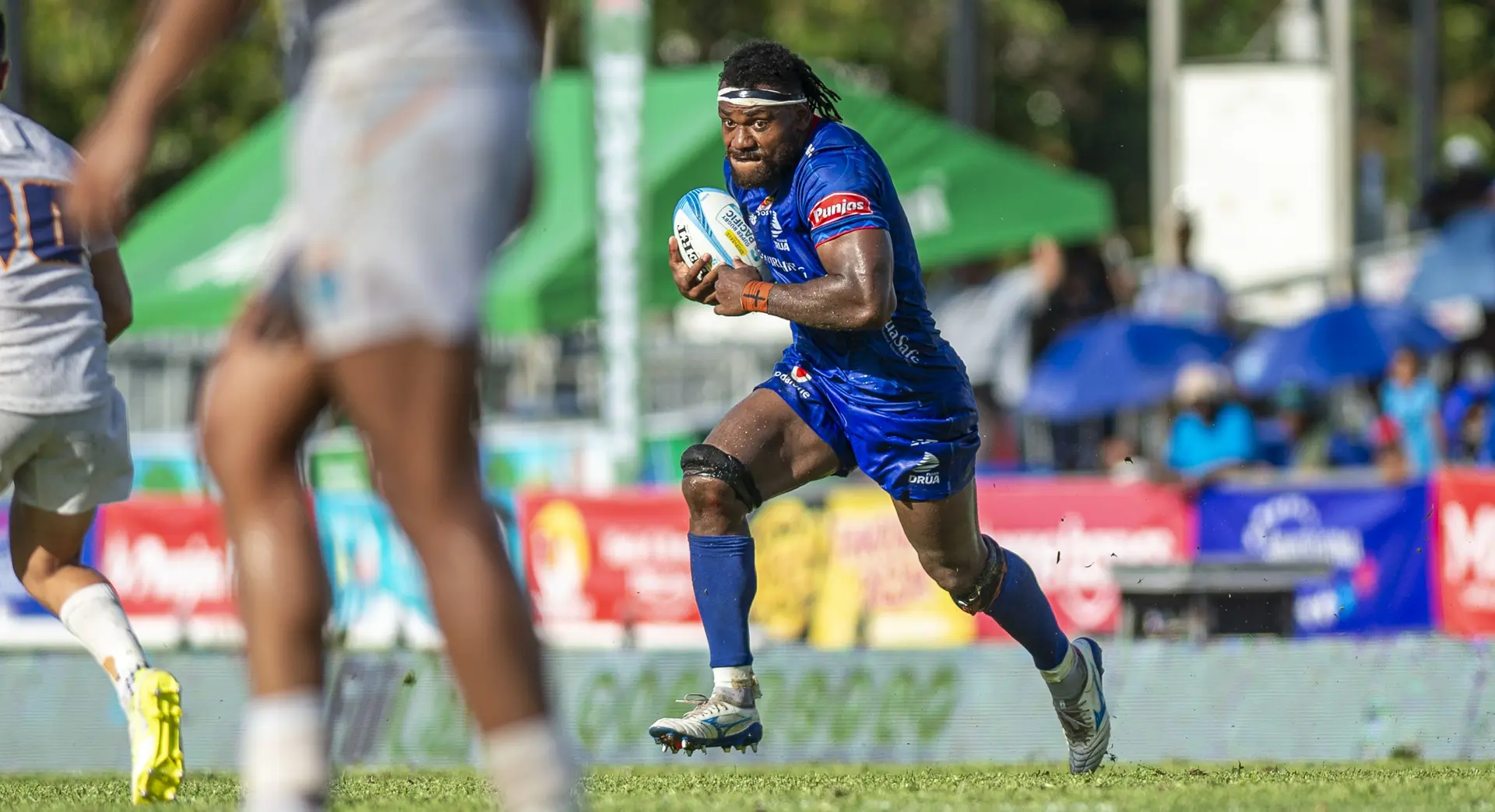Fijian Drua No.8 Elia Canakaivata on the run against Moana Pasifika during their Super Rugby opener at Churchill Park, Lautoka, on February 14, 2026. 