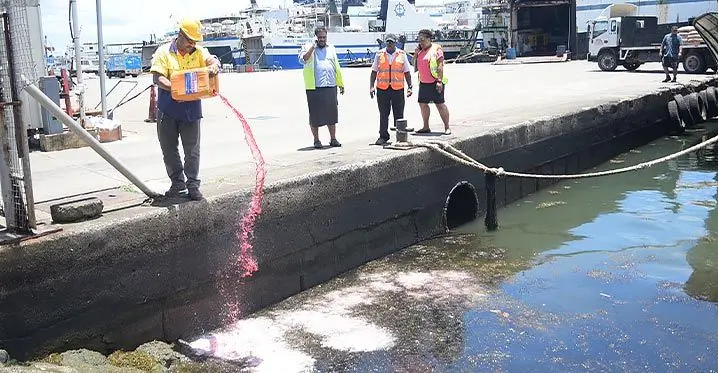 Ports Fiji staff uses the sea kleen chemical for oil spill emulsifier as containment measures for large area of oil spill along Port Mua-i-Walu in Walubay, Suva on February. 2023. Photo: Ronald Kumar