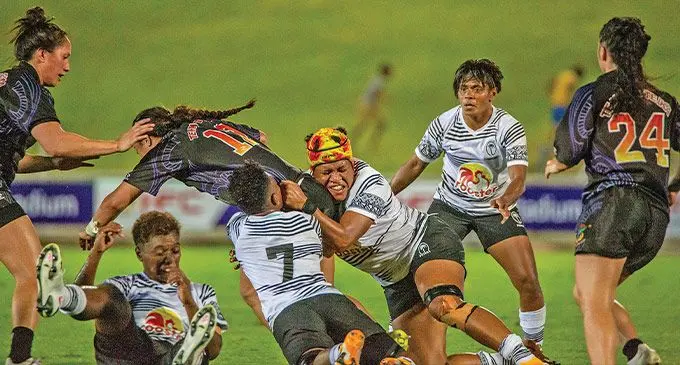 Rooster Chicken Fijiana 15s captain Sereima Leweniqila (with headgear) and Ema Adivitaloga stops Wahine Maori winger Shyanne Thompson during their Test match at the HFC Bank Stadium, Suva on September 16, 2022. Photo: Leon Lord
