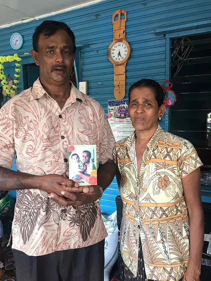 From left, Jack Prasad holding a picture of his late son Bimlesh Prasad with his wife Urmila Devi. Photo: Laisa Lui