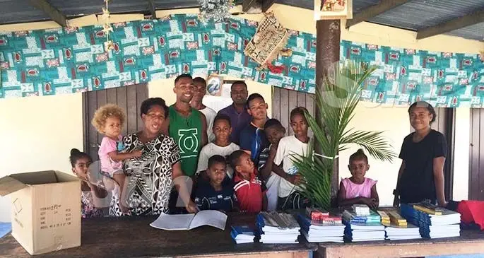 The Western Charity Alliance Group executive director Jitendra Naidu handing over the books and stationery to the children of Navakai HART Home in Nadi on January 10, 2020. Photo: Mereleki Nai