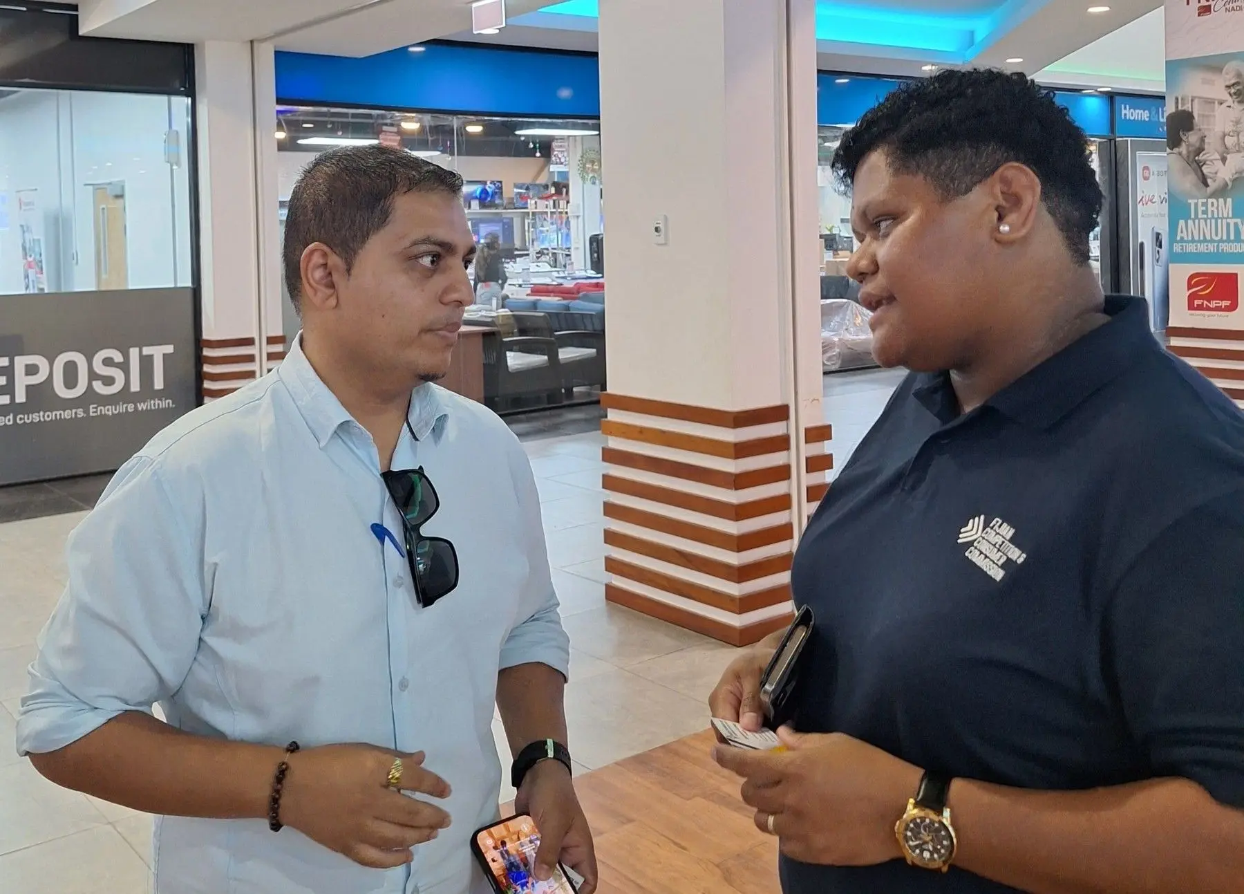 Nadi Chamber of Commerce and Industry president Lawrence Kumar with the Fijian Competition and Consumer Commission chief executive officer Senikavika L Jiuta during the electricity tariff consultation in Nadi. 