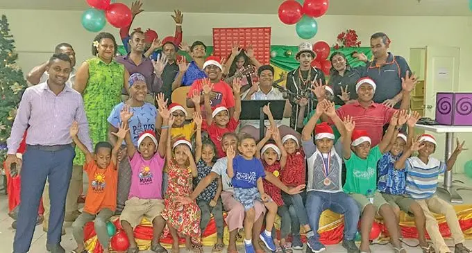 Carpenters Fiji Pte Limited staff members with WOWs Kids Fiji children and representatives. Photo: Kelera Sovasiga