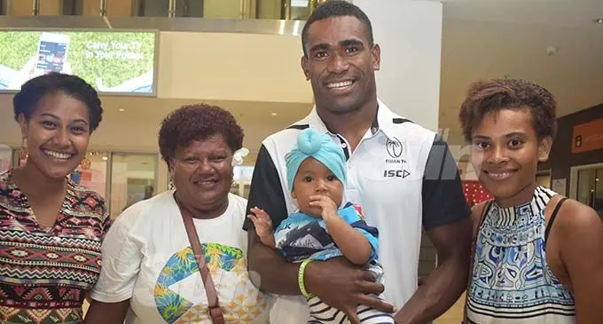Happy to be home: Fiji Airways Fijian 7s rep Aminiasi Tuimaba with family and friends at the Nadi International Airport on December 18, 2019. Photo: Waisea Nasokia
