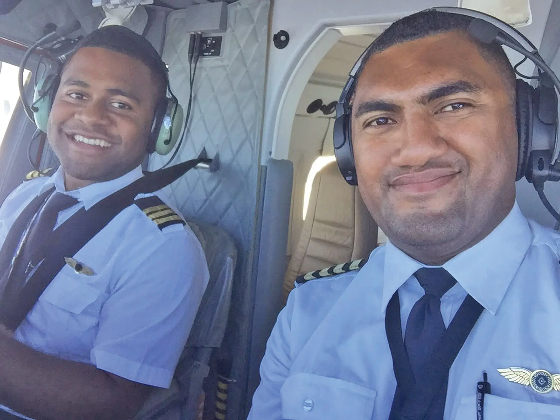 Saula Norman Homutovu Naikatini (left) with work colleague Kemueli Naqau getting ready for take off.