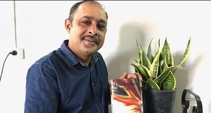 Dill Shard Hussain Ibrahim holding his book Chronicles of Blahz, Spells of Witches in Labasa on January 27, 2023. Photo: Shratika Naidu