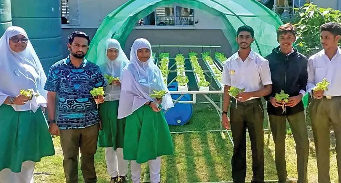 Kamil Muslim College assistant mathematics and physics teacher Rinal Prasad (second from left), with students at one of the nurseries set up at the school on July 3, 2024. Photo: Go Global Hydroponics & e-Agriculture
