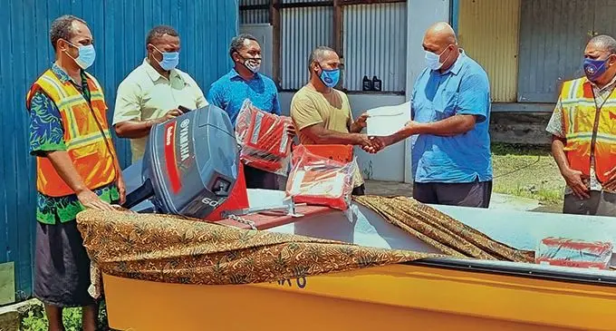 (Fourth from left) Dogoi Settlement headman, Benny Johan Louis, receives the final documentation papers from Commissioner Northern, Uraia Rainima, during the fibreglass boat and engine handover at the Commissioner Northern’s warehouse in Vatunibale, Labasa on January 19, 2022. Photo: Sampras Anand