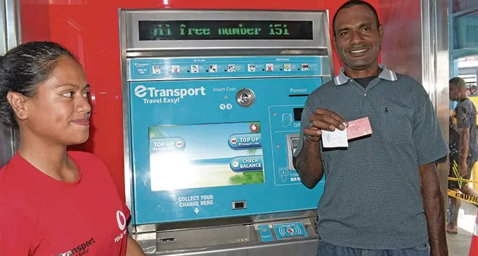 Maleli Rokovunisei of Naitasiri was the first e-card holder to use the eTicket- ing vending machine at the Suva Bus Stand after being assisted by Vodafone e-card personnel Grace Rigamoto on April 6, 2019. Photo: Ronald Kumar