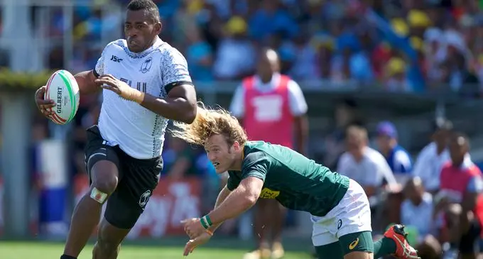 Fiji Airways Fijian 7s prop Sevuloni Mocencagi runs past South Africa’s Werner Kok during the Cup semi-finals of the New Zealand 7s on January 27, 2019. Photo: Bruce Southwick/ZoomFiji