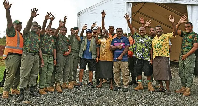 Prime Minister Voreqe Bainimarama with members of the Republic of the Fiji Military Forces during relief efforts in the Northern Division.  Photo: DEPTFO News