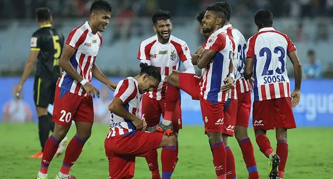 Roy Krishna lavished by teammates after scoring the second goal against Hyderabad in the Indian Super League at Salt Lake Stadium in Kolkata, India on October 26, 2019.