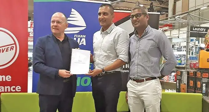 From left: Swire Shipping Fijian Drua chief executive officer Mark Evans, Vinod Patel CEO Rahul Amin and Home and Living CEO Jatin Patel at the Vinod Patel Centrepoint branch in Laucala Beach, Suva on December 1, 2022. Photo: Sereana Salalo