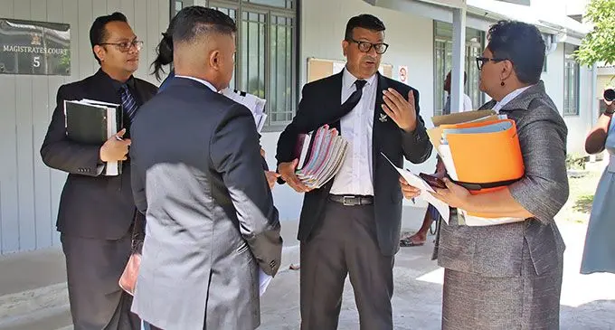 From left: DPP lawyer, Hezekiah Nofaga (back), Mohammed Saneem, defence lawyer, Devanesh Sharma (middle) and Acting DPP, Nancy Tikoisuva outside the Suva Magistrate’s Court on October 7, 2024. Photo: Beranadeta Nagatalevu