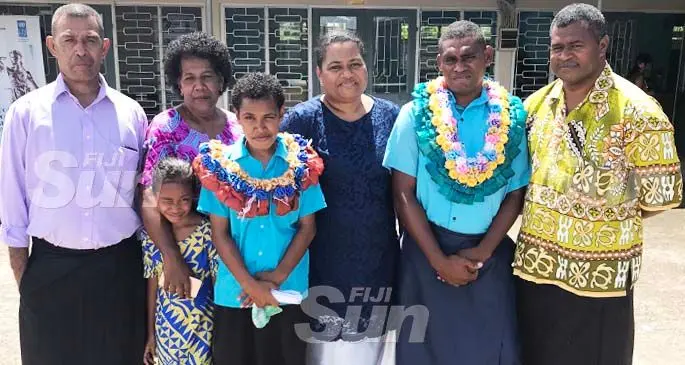 Fiji Vocational Technical Training Centre for Persons with Disabilities head girl Milika Turaga (fourth from left) and head boy Vilimone Baleinayau (second from right) with their families during their prefects induction in Suva on February 8, 2020. Photo: Inoke Rabonu.