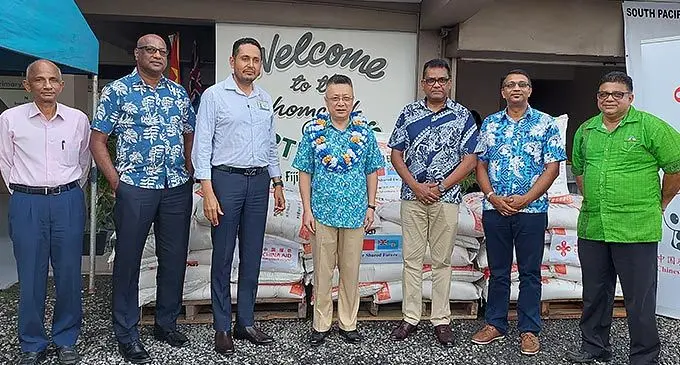 From left: Sugar Research Institute of Fiji CEO, Professor Sandiago Mahimaraja, SPFL board director, Sundresh Chetty, SPFL CEO, Ashween Ram, Chinese Ambassador to Fiji, Qian Bo, Permanent Secretary for Foreign Affairs, Immigration and Sugar Industry, Yogesh Karan, Sugar Cane Growers Council CEO, Vimal Dutt and the Sugar Cane Growers Fund CEO, Raj Sharma following the handover in Lautoka on November 11, 2022. Inset: Chinese Ambassador to Fiji, Qian Bo speaking with the Permanent Secretary for Foreign Affairs, Immigration and Sugar Industry, Yogesh Karan following the handover in Lautoka Photos: Nicolette Chambers