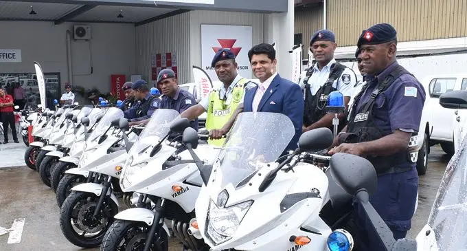 Acting Prime Minister and Attorney-General Aiyaz Sayed-Khaiyun (third from right) with Police traffic officers after receiving 30 motorcycles for Police from Asco Motors on February 27, 2018. Photo: Ronald Kumar