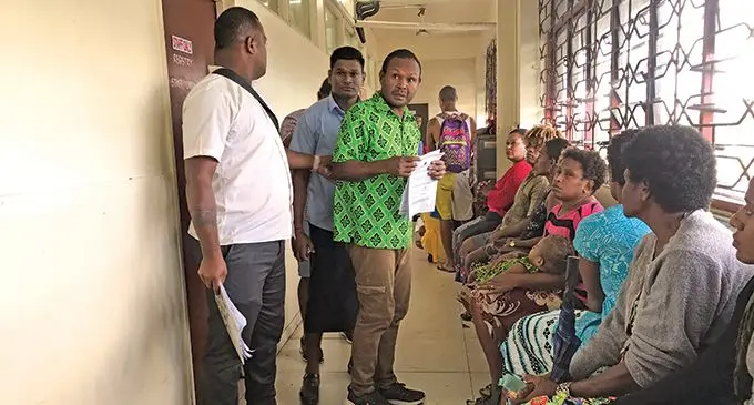 Semi Nate (in pink shirt), and Eparama Mani, (in green shirt) outside the Magistrates Court in Nausori on May 9, 2022..  Photo: Ashna  Kumar