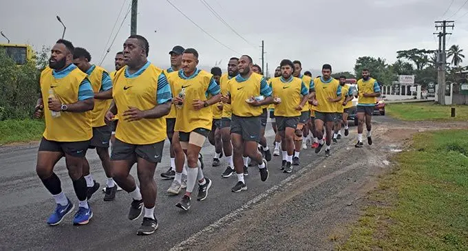 Flying Fijians tightheads props (left-right) Mesake Doge and Manasa Saulo lead the pack during the team’s road run from the Tanoa International Hotel to the Nadi International School ground (through Nadi backroad) for their first training  session on June 20, 2022. Photo: Nicolette Chambers   