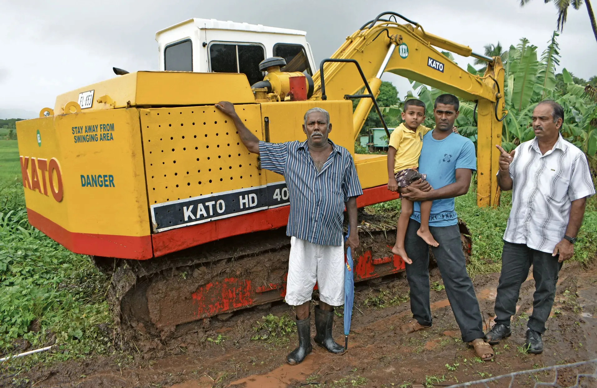 Ministry of Waterways senior agriculture officer Northern Gyan Chandra (right) showing the drainage work that begun in Qelawaqa, Labasa as he stands with Bal Raj (left) and Ritesh Raj who are rice farmers on February 6. Photo:Shratika Naidu