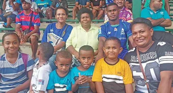 Fijian Drua development player Taniela Rakuro (back first from right) with his family following their trial match against Melbourne Rebels at Prince Charles Park, Nadi on January 28, 2023. Photo: Sereana Salalo