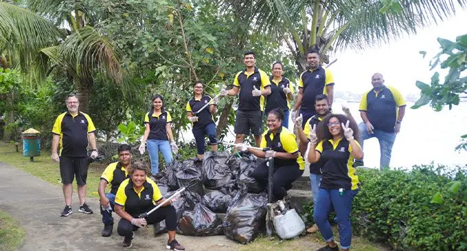 Nestlé volunteers donned gloves and gathered to clean up Tikaram park.