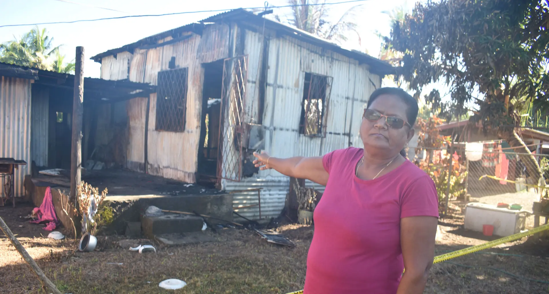 Sumintra Devi pointing to the house that was destroyed by fire at Saravi Road, Navakai Nadi. Photo: Mereleki Nai