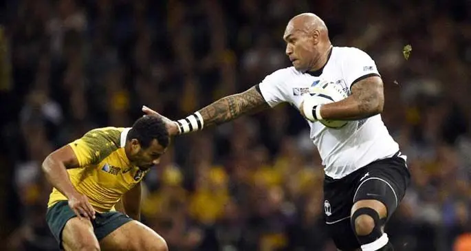 Former Flying Fijian winger Nemani Nadolo tries to get away from Australian halfback Will Genia during their Pool C clash at the 2011 Rugby World Cup.Photo:World Rugby