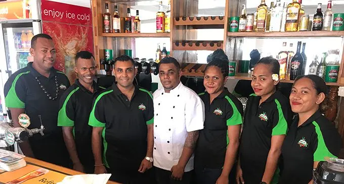 Green Chili Pizza Wine and Dine chef and executive officer Robin Chand (third from left) with his staff in Labasa. Photo: Shratika Naidu