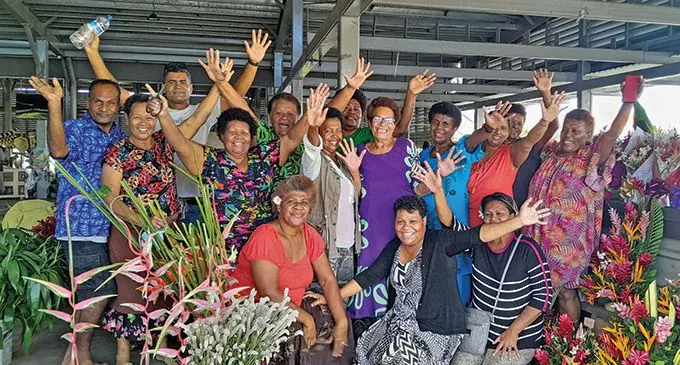 Florist in a jovial mood at the Namaka Market. Photo: Waisea Nasokia 