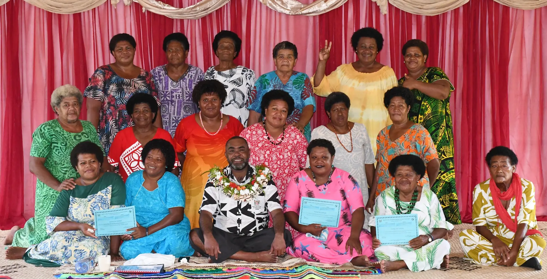 The women of Udu in Macuata with the Ministry of Rural and Maritime Development and Disaster Management Mosese Bulitavu.