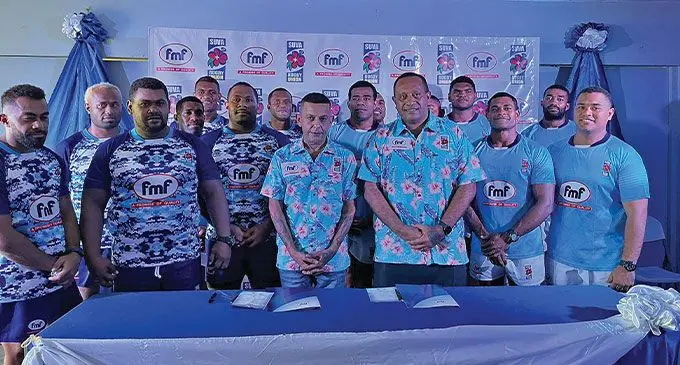 FMF Foods managing director Sanjay Punja (standing fourth from left in front) and Suva Rugby Union chairman Lieutenant Colonel Viliame Draunibaka (fifth from left in front) during their sponsorship signing at the HFC Bank Stadium corporate box on December 2, 2022. Photo: FMF