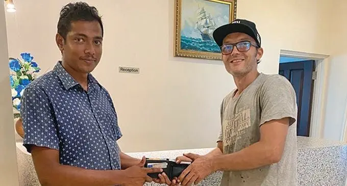 Fantasy Island Fiji construction site supervisor Saiyad Aznal Hussein (left), hands over the wallet to its rightful owner Manuel May at the Fantasy Island Fiji office, Nadi. Photo: Waisea Nasokia