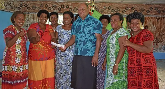 Minister of Forests Osea Naiqamu hands the cheque to the Nasavu Women’s Group at Nasavu Village in Bua on February, 23, 2018. Photo: Wati Talebula