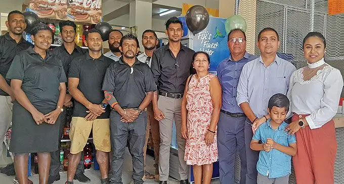 Businessman Lawrence Kumar, wife Shalini and son Alrick with relatives and staff. Photo: Waisea Nasokia