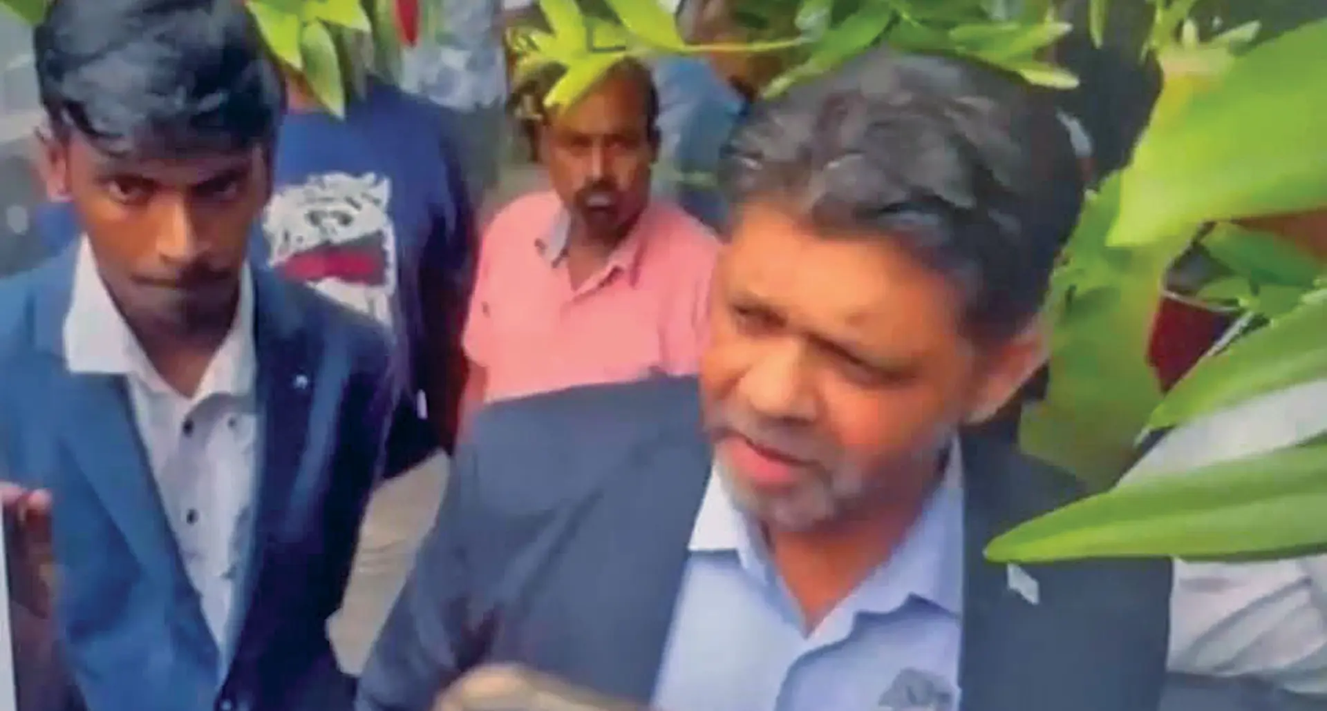 Social worker and youth advocate Abdul Zorhab beside former Attorney-General Aiyaz Sayed-Khaiyum outside court.