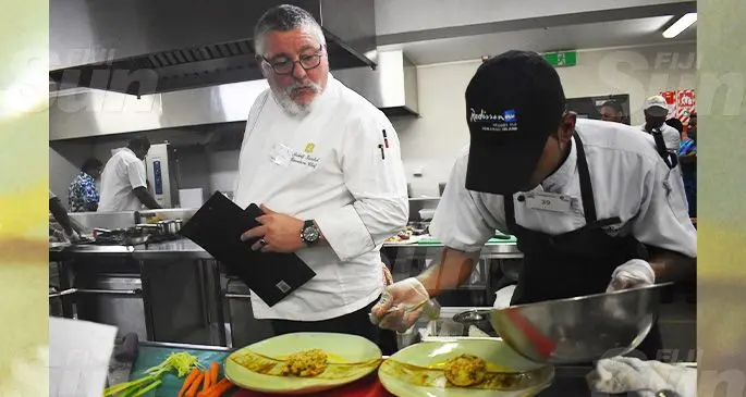 The beef dish competition head judge, Rudolf Kunkel (left) who is Shangri-La’s Fijian Resort and Spa Executive Chef judging Radisson Blu Resort Fiji chef, Amitesh Narayan’s (right) dish. Photo: Nicolette Chambers