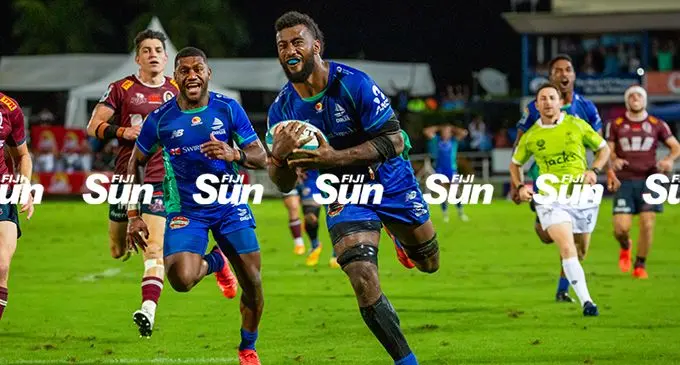 Swire Shipping Fijian Drua flanker Joseva Tamani on his way to score against Reds at the HFC Bank Stadium tonight. Photo: Leon Lord