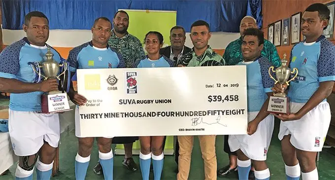 Jack’s of Fiji public relations officer Biu Tadranu (third from right hands over the cheque to the participating members of the Suva Rugby Union in Walu Bay on April 12, 2019. Photo: Grace Narayan