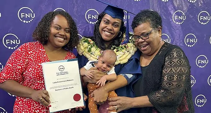 Lydia Matavesi and baby Gideon Abel Ryder Matavesi flanked by her sister, Asilika Matavesi and mother, Makereta Matavesi after the FNU Graduation at the Vodafone Arena, Suva on December 22, 2022. Photo: Viliame Tawanakoro